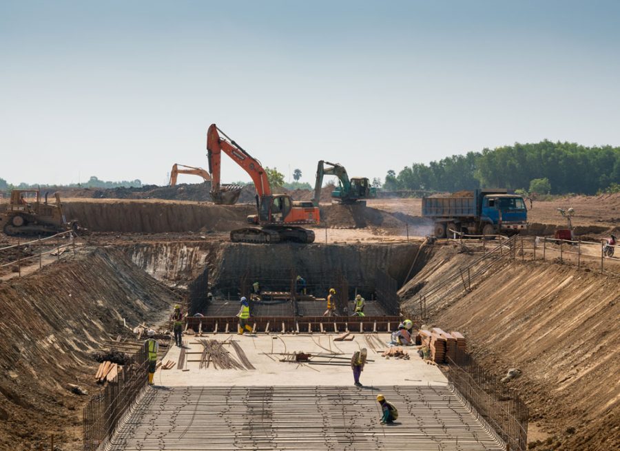 heavy-machines-construction-workers-working-building